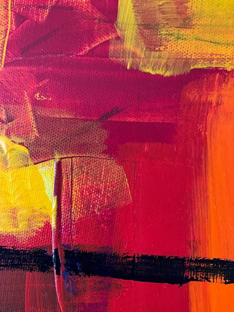 Dynamic abstract artwork featuring bold red, orange, and yellow brushstrokes.